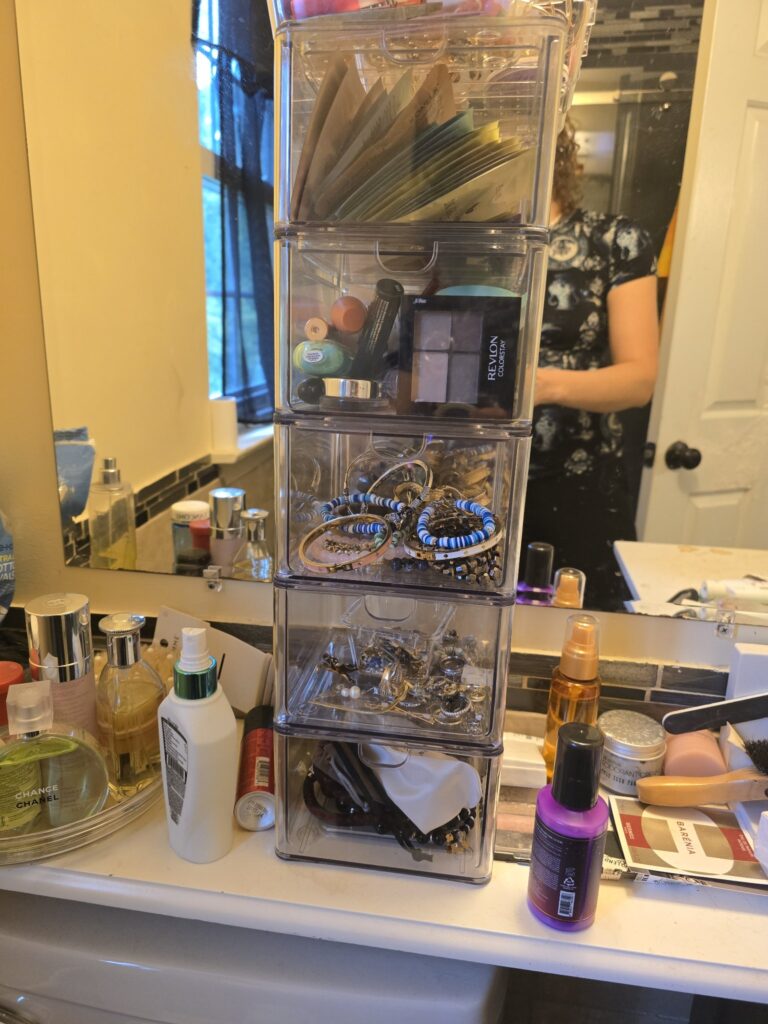 Clear stackable drawers with makeup and jewelry